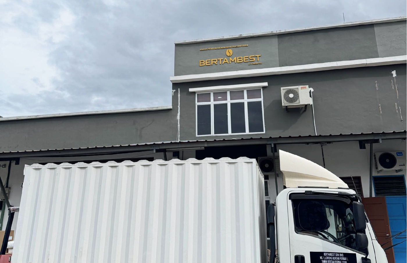 BertamBest premix beverage manufacturing factory in Kepala Batas, Penang, with a delivery truck at the loading bay